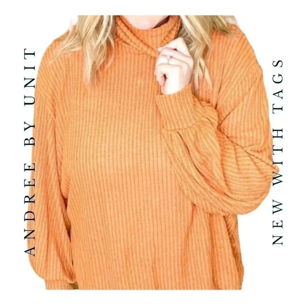 2020. ANDREE BY UNIT LONG SLEEVE TOP BALLOON SLEEVES OPEN BACK ORANGE IN COLOR